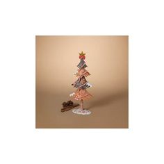 a small wooden christmas tree sitting on top of a table