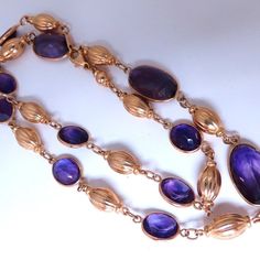 50ct. Natural Amethyst Necklace Purple Amethyst 19 X 9mm Largest 6 X 8 Smallest Necklace: 19 Inches Long (Wearable Dimension). 14kt Yellow Gold 26.5 Grams. $7000 Appraisal Certificate To Accompany Formal Purple Amethyst Necklace, Elegant Purple High Luster Jewelry, Elegant High Luster Purple Jewelry, Luxury Yellow Gold Amethyst Necklace, Luxury Purple Cabochon Jewelry, Formal Yellow Gold Amethyst Necklace, Elegant Purple Necklace With Polished Finish, Formal Purple Cabochon Gemstones, Elegant Amethyst Necklace With Polished Finish