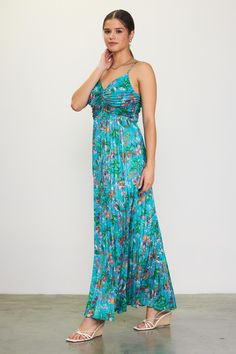 This pleated maxi dress features a vibrant print of tropical flowers. The strappy number has a tunnel tie that gathers the bust, so you can adjust the neckline as you like. •Adjustable spaghetti straps •Adjustable tie detail at bust •Pleated •Hidden back zipper Item Number: 99874 100% POLYESTER Vacation Dresses Casual, Wedding Guest Dress Trends, Print Pleated Dress, Maternity Midi Dress, Leather Midi Skirt, Casual Wedding Dress, Pleated Maxi Dress, Pleated Maxi, Satin Midi Dress