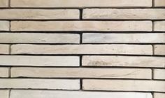 a white brick wall that is made out of wood