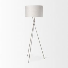 a floor lamp with a white shade on the top and one light on the bottom