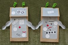 two paper bags made to look like robots