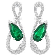 Elegant and Exquisitely detailed White Gold earrings, with 7.56 CT's (total approx.) Emerald cut in Elongated Pear Shape, and accented with micro pave Diamonds, weighing approx. 1.86 CT's. (total approx.). total carat weight. Beautifully Hand-Crafted Earring in 18 Karat White Gold for your special someone. Product Details: - Primary Stone: - Emerald Primary Stone Shape: - Pear shape Primary Stone Cut: - Faceted Primary Stone Size: -15.6X8.10MM,15.75X8.10MM Primary Stone Weight: - 7.56 CT's. (app Emerald Diamond Earrings, White Gold Earrings, Stone Cuts, Emerald Diamond, Micro Pave, Pear Shape, Emerald Cut, Pave Diamonds, Earring Gifts