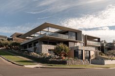 a modern house on the corner of a street