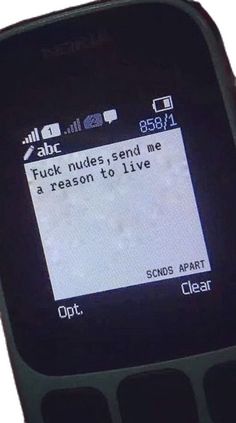 an old cell phone with a message on the screen that reads, fock nues send me a reason to live