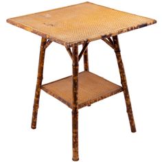 an old wooden table with wicker on the top and bottom shelf, isolated against a white background