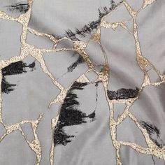 the fabric is very thin and has black trees on it's side, as well as gold foil