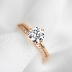 The Sage Engagement Ring is dainty yet modern with single claw prongs set in a compass orientation. This is the perfect unique twist to a traditional solitaire. This ring can be set with any size or shape of center stone and is available in 14k or 18k yellow gold, white gold, rose gold or platinum. Have more questions or want to try it on? Book an appointment to sit down with one of our bridal experts virtually or in-store. Pepper Band, Bezel Necklace, Bespoke Engagement Ring, Claw Prong, Twist Ring, Round Moissanite, Marquise Diamond, Diamond Cluster Ring, Signature Jewelry