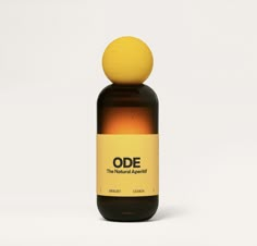 an orange and yellow dropper bottle with the word ode on it's top