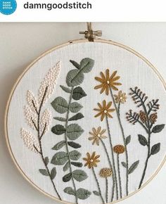 an embroidery pattern with flowers and leaves on it