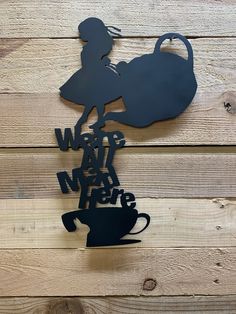 a metal sign that says,'we are happy new year'with a silhouette of a woman holding a coffee cup