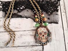 "All my creations, even the smallest are made in a single copy (unique piece)   Gothic Skull Pendant\" UNAKITE beads and genuine cut crystals. The cabochon is made of \"crystal\" resin with metal inclusions and small white glass crystals. Gothic Pendant Necklace sold with its gold and black braided metal chain. - size height 5 cm /1.77\"x Wide 4.8 cm/  1.57\"  Nice gift idea. Mid-length neck circumference = 28 cm/11.02\"" Bohemian Gold Jewelry For Halloween, Bohemian Jewelry For Halloween Gift, Handmade Bohemian Jewelry For Halloween, Handmade Metal Jewelry For Halloween, Unique Skull Jewelry For Gift, Halloween Handmade Metal Jewelry, Unique Nickel Free Skull Jewelry, Unique Skull Jewelry For Halloween, Halloween Skull Jewelry For Jewelry Making