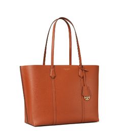 Directly from Tory Burch - A thoughtful approach to extreme function. The Perry tote is updated with additional pockets for organization, longer straps that fit comfortably over the shoulder and extra room - with a center zip compartment that fits a laptop. Made of Italian pebbled leather, it now has protective feet and comes with a removable charm, in tonal or contrast colors. Tory Burch Official Site. Workwear Tote Bag With Interior Card Slots, Office Tan Tote Bag, Tan Office Tote Bag, Tan Tote Shoulder Bag For Work, Tan Tote Bag For Work, Tan Tote Bag For Workwear, Office-friendly Tan Tote Bag, Modern Tan Bags For Work, Modern Tan Bags For Workwear