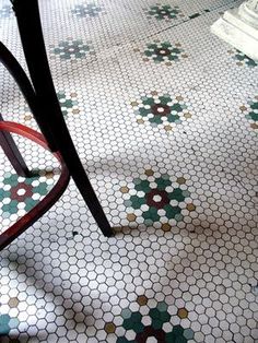 a chair sitting on top of a tiled floor