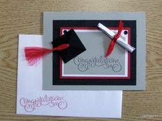 congratulations card with graduation cap, diploma and mortar on the front in black and red