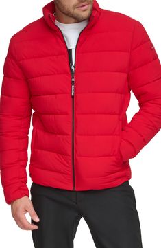 A tall stand collar structures this weather-ready puffer jacket crafted from stretch quilted fabric. Stand collar Long sleeves 100% Sorona polyester
 Machine wash, tumble dry Imported Model stats: 6'1" height, 32" waist. Model is wearing size Medium. Red Nylon Puffer Jacket For Fall, Fall Red Nylon Puffer Jacket, Casual Red Down Puffer Jacket, Red Nylon Puffer Jacket For Cold Weather, Red Fitted Nylon Outerwear, Calvin Klein Long Sleeve Puffer Jacket For Fall, Calvin Klein Long Sleeve Winter Puffer Jacket, Calvin Klein Fall Puffer Outerwear, Quilted Fabric