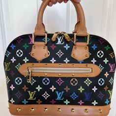 Beautiful Louis Vuitton Alma Bag In Black Multicolor Logo With Gold Hardware. Bag Was Carried Only A Handful Of Times So It Is In Excellent Condition Inside & Out. She’s Lovely! Louis Vuitton Alma Bag, Bags Louis Vuitton, Louis Vuitton Bags, Gold Hardware, Louis Vuitton Bag, Inside Out, Satchel, Bag Lady, Louis Vuitton