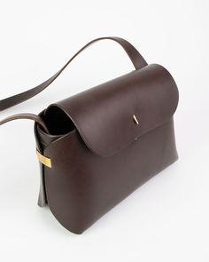 Elegant Brown Saddle Bag With Leather Handles, Brown Flap Bag With Smooth Grain For Daily Use, Everyday Brown Flap Bag With Smooth Grain, Elegant Brown Shoulder Bag In Vegetable Tanned Leather, Timeless Brown Flap Bag With Removable Pouch, Everyday Brown Smooth Grain Flap Bag, Timeless Brown Bucket Bag, Elegant Brown Vegetable Tanned Leather Shoulder Bag, Timeless Brown Shoulder Bag With Removable Pouch