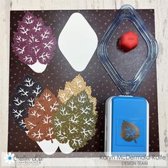 some crafting supplies are laying out on a table with the words autumn written in it