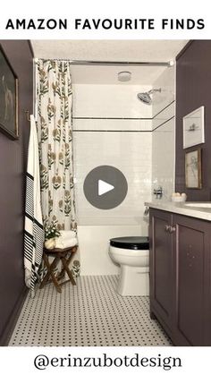 the bathroom is decorated in shades of gray and white, with an interesting pattern on the shower curtain