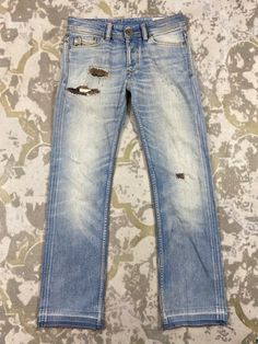 31x30.5 Distressed Blue Vintage Diesel Jeans Denim- JN3731 Size: 31 Actual measurement (inches): Waist - 31 Front Rise - 9.5 Hips - 40 Thigh - 11 Knee - 8 Leg Opening - 16 Inseam - 30.5 Outseam - 40.5 Material : Cotton    #JN3731 Rugged Fitted Blue Jeans, Blue Rugged Fitted Jeans, Fitted Rugged Blue Jeans, Distressed Recycled Denim Blue Jeans, Distressed Jeans In Denim Blue With Recycled Denim, Rugged Ripped Medium Wash Jeans, Rugged Ripped Blue Jeans, Rugged Distressed Blue Jeans, Rugged Blue Distressed Jeans