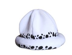 a white hat with black spots on it