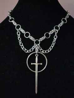 With an adjustable length of 16.5"-20", this gothic style of necklace features a byzantine weave as well as stainless steel O-rings and pendants. The weave is hand-made from aluminum making it lightweight, yet durable. If you want to make adjustments to the length of the chain, please leave a note with the order and I will be happy to accommodate! O Ring Necklace, Gothic Necklaces, Butterfly Fashion, Edgy Jewelry, Y2k Necklace, Retro Accessories, Mixed Metal Jewelry, Gothic Necklace, Ring Der O