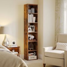 a bed room with a neatly made bed and a book shelf next to the window