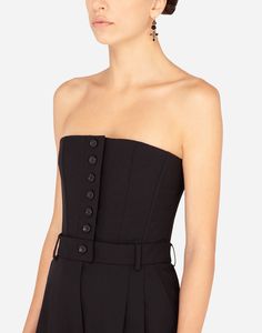 This strapless stretch wool jumpsuit by Dolce&Gabbana combines tradition and modernity, resulting in a timeless elegant piece. The bustier shape accentuates feminine silhouette, making it perfect choice for those who want to enhance their beauty. Made from high-quality wool, offers both style comfort. Formal Fitted Strapless Jumpsuit, Fitted Strapless Jumpsuit For Cocktail Occasions, Formal Strapless Fitted Jumpsuits And Rompers, Formal Strapless Fitted Jumpsuit, Fitted Strapless Jumpsuits And Rompers For Formal Occasions, Strapless Fitted Jumpsuit For Formal Occasions, Strapless Fitted Jumpsuits And Rompers For Gala, Elegant Fitted Strapless Jumpsuits And Rompers, Elegant Strapless Fitted Jumpsuits And Rompers