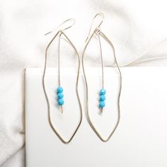 Spring is officially here! 🍃 What fresh new pieces are you excited to add to your look this season? Elegant Sterling Silver Gemstone Linear Earrings, Elegant Handmade Blue Linear Earrings, Nickel-free Teardrop Metal Linear Earrings, Turquoise Nature-inspired Drop Earrings, Turquoise 14k Gold-filled Earrings With Ear Wire, Crystal Centerpieces, Thoughtful Gifts For Her, Earrings Collection, Etsy Jewelry