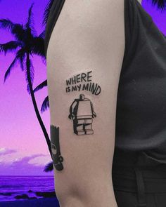 a woman with a tattoo on her arm that says, where is my mind?