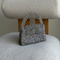 Elegance Crystal Beaded Bag - Handcrafted Evening Clutch Whether you're attending a glamorous gala, a romantic dinner, or a chic cocktail party, this beaded bag is the perfect accessory to complement your attire. It effortlessly transitions from a dazzling statement piece to a timeless classic, making it a versatile addition to your collection. Versatile Size: Compact yet spacious enough to hold your essentials - phone, lipstick, keys, and more. The bag is woven from fishing  line, which can withstang 35 kg. It is very reliable as it closes with a magnetic clasp. 100% handmade Material: crystal beads  Size:  > width - 20 cm | 8 inches > height - 12 cm (23 cm  with handle) | 4,7 inches (9 inches with handle) > lateral width - 7 cm | 2,8 inches Lining: royal satin Includes 1m | 40 inches ste Beaded Top Handle Evening Bag, Silver Beaded Bag As A Gift, Silver Beaded Bags Suitable For Gifts, Silver Beaded Bags As Gift, Glamorous Beaded Rectangular Evening Bag, Glamorous Rectangular Beaded Evening Bag, Silver Beaded Bag For Events, Silver Beaded Shoulder Bag For Gift, Silver Beaded Shoulder Bag As Gift