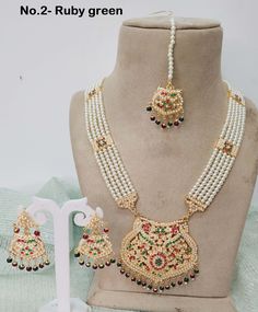 Jadau Rani Haar high quality necklace Set embellished with pearls. Necklace length: 13 inches (including pendant) Earrings length: 2.8 inches (with drops) ;  Width: 1.6 inches Bollywood Style White Pearl Necklace With Meenakari, White Kundan Pearl Necklace For Festivals, Festive White Pearl Necklace With Stone Work, White Bollywood Pearl Necklace With Cutdana, White Meenakari Beaded Temple Jewelry Necklace, White Bollywood Pearl Necklace For Festivals, Bollywood Style Meenakari Pearl Necklace, White Cutdana Bollywood Style Pearl Necklace, White Beaded Necklace With Meenakari For Festivals