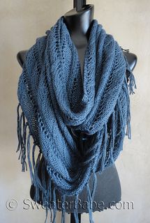 a mannequin wearing a blue knitted scarf