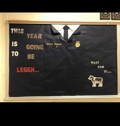 a bulletin board with an image of a man's shirt and tie on it