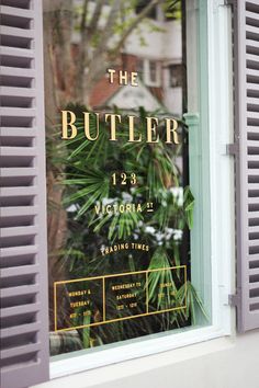 the front window of a building with a sign on it that says, welcome to the butler victoria 2 trading times