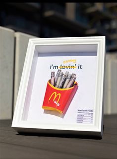 a mcdonald's advertisement is framed in a white frame