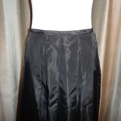 "Striking and stunning long length Black Taffeta Silk Like Skirt which can be dressed up or dressed down and has a classic timeless appeal to it. This is made with 100% Acetate Fabric and is Dry Clean Only. Measurements of this Mint Condition, Never Worn, Long Length Pleated Skirt are as follows: Length: 42\" long Waist: 14.5\" wide, or 28\" all around Hips: 32\" wide or 64\" all around Easy to ship, this will be insured for the price paid against loss and/or damage during transit. Thank you for Fitted A-line Maxi Skirt With Gathered Detail, Fitted A-line Maxi Skirt With Lining, Fitted A-line Pleated Skirt For Party, Fitted Silk Pleated Skirt For Party, Fitted A-line Satin Skirt, Fitted A-line Pleated Skirt For Evening, Fitted Full Maxi Skirt With Accordion Pleats, Formal Fitted Maxi Skirt With Gathered Detail, Formal Fitted Full Pleated Skirt