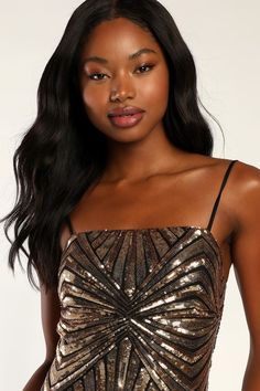 Lulus Exclusive! When you arrive in the Lulus Lost In Your Eyes Gold Sequin Bodycon Mini Dress, everyone won't be able to take their eyes off of you! Sparkling gold sequin-adorned mesh, atop a black liner, shapes this sexy mini that has a straight neckline (with hidden no-slip strips) and adjustable spaghetti straps. A fitted, darted bodice sweeps down a figure-flaunting silhouette that ends at a mini hem. Hidden back zipper/clasp. Fit: This garment fits true to size. Length: Mid-thigh. Size sma Gold Embellished Sequin Dress For Date Night, Gold Sequin Dress For Prom Night Out, Gold Sequin Dress For Prom Season Night Out, Gold Sleeveless Sequin Fabric For Party Season, Gold Sequin Fabric For Party Season, Glamorous Gold Sequin Dress For Date Night, Glamorous Gold Sequin Homecoming Dress, Gold Sequin Dress For Homecoming And Prom Season, Fitted Gold Sequin Dress For Prom Season