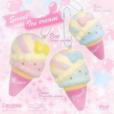 three ice cream shaped keychains on a pink and white background with snowflakes