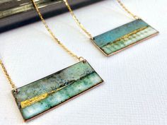 "Rectangle enamel pendant - Landscape inspired These stunning rectangle pendants have been handmade using copper, vitreous enamel and 24ct gold foil available in blue or green. To create the impression of a landscape layers of vitreous enamel have been used to build up the depth and variation in colour and then finished with gold foil. Each pendant measures 40mm x 15mm 18\" Gold plated sterling silver chain NOTE: Due to the way in which the enamel is applied there will be colour variation and no one piece will be exactly the same, and may vary from the image shown.  This makes each piece unique to you.  I am more than happy to email you a photo of your item before I post if if this is a concern." Gold Enamel Jewelry With Soldered Details, Hand Painted Rectangular Jewelry As Gift, Red Statement Earrings, Boho Jewelry Diy, Rectangle Necklace, Enamel Stud Earrings, Vitreous Enamel, Enameled Copper, Enamel Necklaces