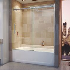 a bath tub sitting next to a window with a cityscape in the background