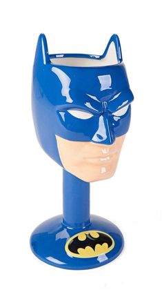 a blue ceramic batman mask on top of a head