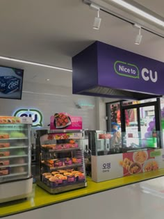 the inside of a donut shop with display cases