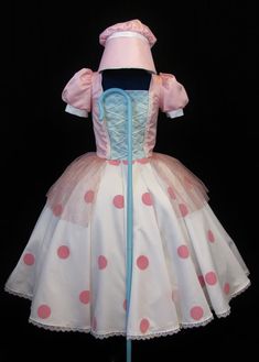 a dress made to look like a ballerina with pink and white polka dots on it