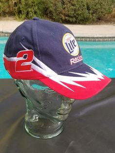 "Awesome vintage Miller Lite Nascar racing baseball hat/cap with embroidered patches.  This is either very dark navy or black, hard to tell with red embroidered 2 white embroidered lightning bolts. Excellent \"vintage\" condition  This has never been worn, still has the cardboard inside, but there are a few light spots under the brim (see photo) not sure what it's from?  Velcro, adjustable size. Thanks, Enjoy!   #nascarracing #nascar #millerlite #beer #penske #penskeracing #speed #biker #rocker #nascar #racer #auto500 #auto400 #rustywallace #racing #whiteout #rocker #tattoo #dope #sick #amazing #tribe #gift #mancave #holidaygift #racetrack" Y2k Baseball Cap, Speedway Racing, Rusty Wallace, Biker Tattoos, Dope Hats, Gifts For Truckers, Miller Lite, Lightning Bolts, Light Spots