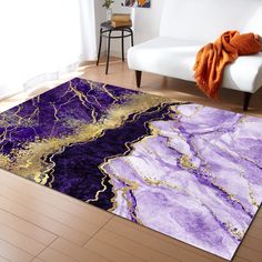 a purple and gold rug in a living room