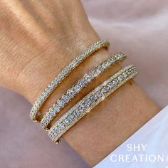 This Diamond Bangle Bracelet boasts an impressive 2.32 carats of diamonds, set in 14K Yellow Gold for a glittering look. Diamond Bangle Bracelet, Diamond Bangles Bracelet, Color Stones, Jewelry Website, Bracelets Gold Diamond, Diamond Bangle, Jewelry Creation, Diamond Stone, Hand Picked