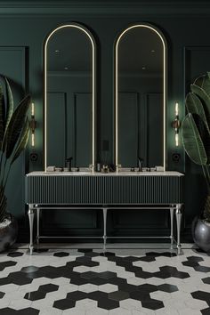 a bathroom with green walls and black and white tile flooring, two large mirrors on the wall