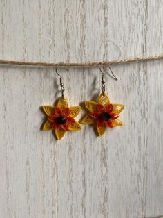 Paper quilled earrings sealed with UV resin. Elegant Orange Flower Earrings For Gift, Yellow Dangle Flower Earrings As Gift, Yellow Dangle Flower Earrings For Gift, Traditional Flower Earrings With Ear Wire As Gift, Orange Flower-shaped Earrings For Gift, Traditional Flower Earrings For Gift, Traditional Flower Shaped Earrings For Gifts, Handmade Orange Flower Shaped Earrings, Handmade Flower Drop Earrings For Gift